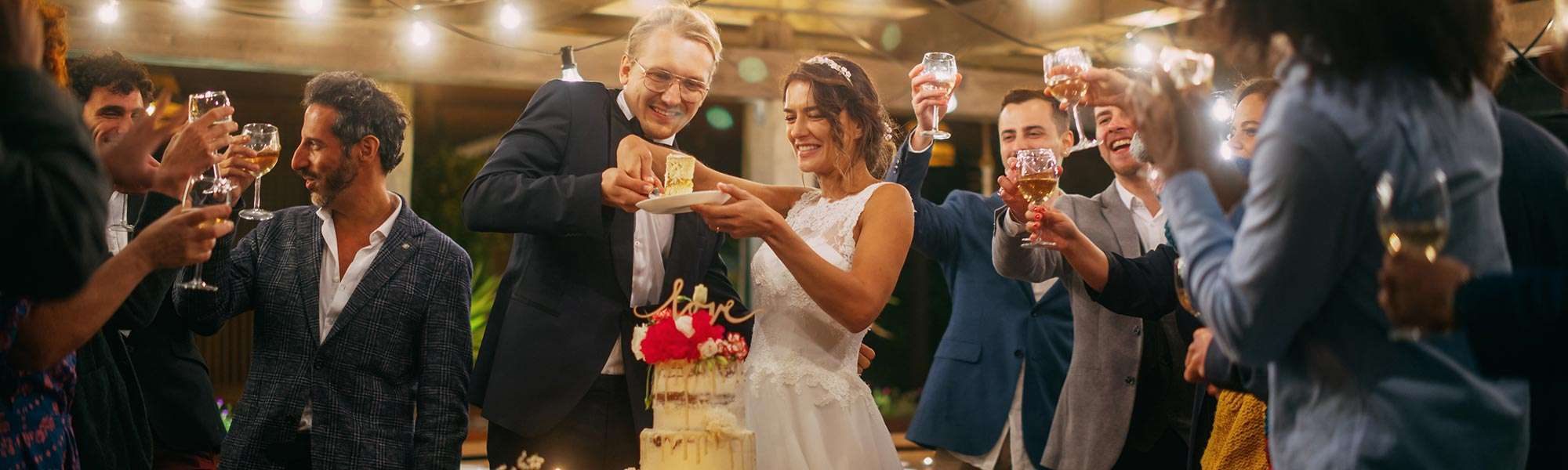 Couple cutting the cake at their reception